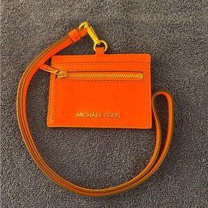 Michael Kors Jet Set Travel East West ID Case Wallet Lanyard Poppy color. EUC.